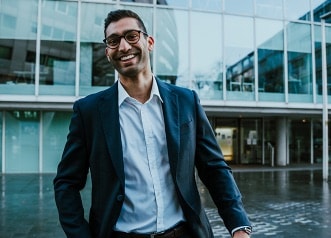 Happy Financial Advisor walking outside building
