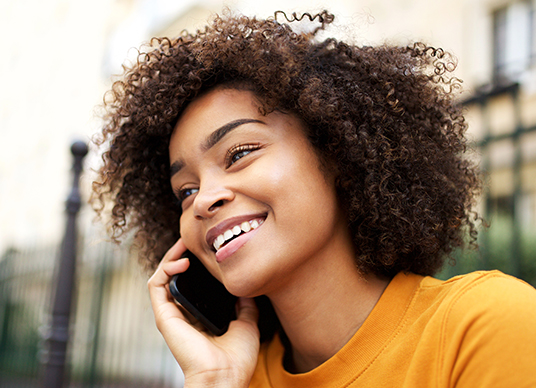 Lady speaking on phone outside