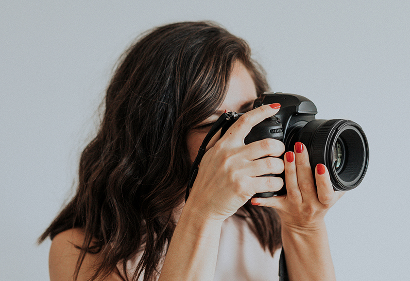 Estate agent taking a pictures of property interior