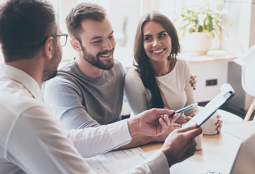 Advisor talking through paperwork with couple